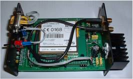 A green electronic device with wires

Description automatically generated